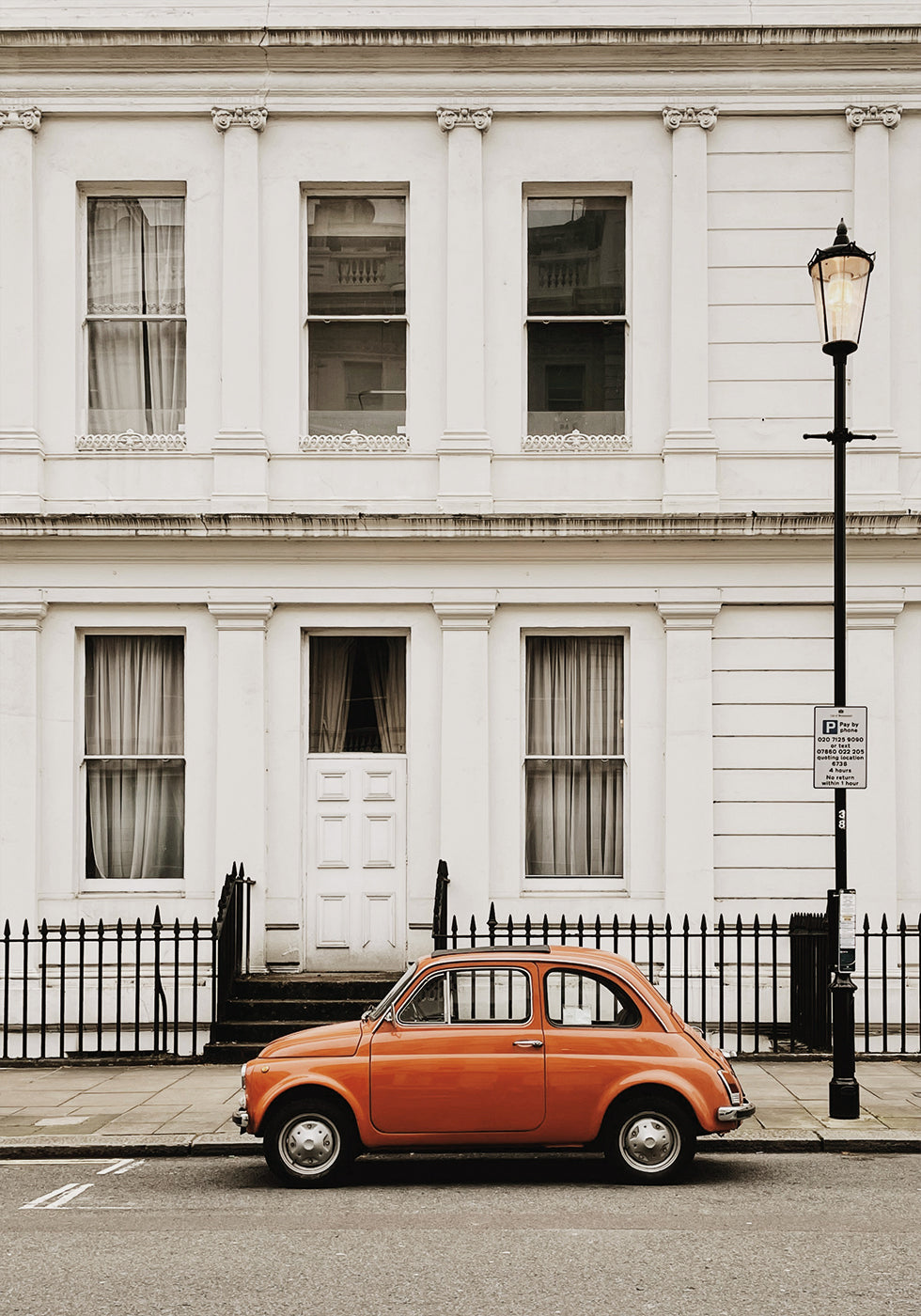 Charming Urban Scene with Orange Car Plakat - Posterbox.dk