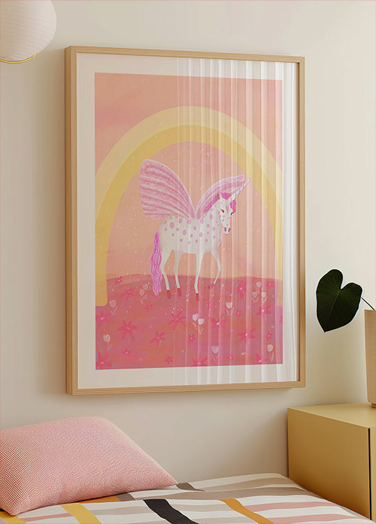 un poster incorniciato di un unicorno con una combinazione di colori rosa e bianco, su uno sfondo rosa e giallo con un arco arcobaleno.